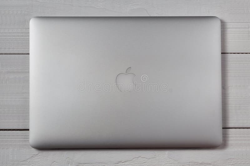 Macbook pro on wooden table stock image Macbook pro on wooden table stock image