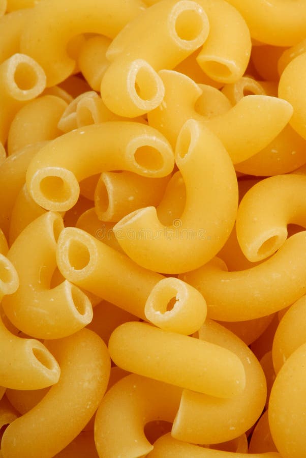 Photo of uncooked Macaroni pasta noodles. Photo of uncooked Macaroni pasta noodles