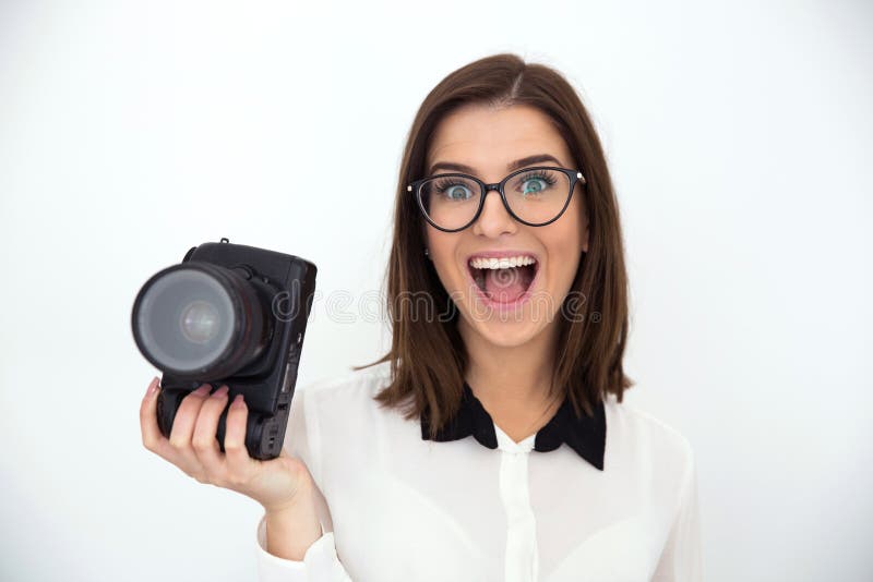Macchina fotografica della tenuta della donna di affari immagine stock Macchina fotografica della tenuta della donna di affari immagine stock