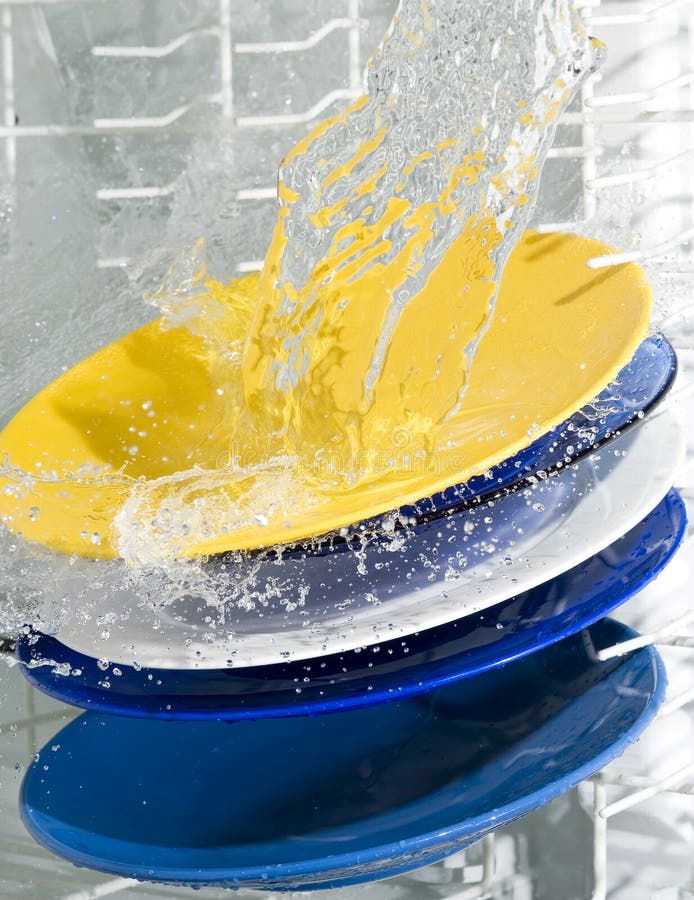 Dish-washing machine and plate. Splashing water. Dish-washing machine and plate. Splashing water