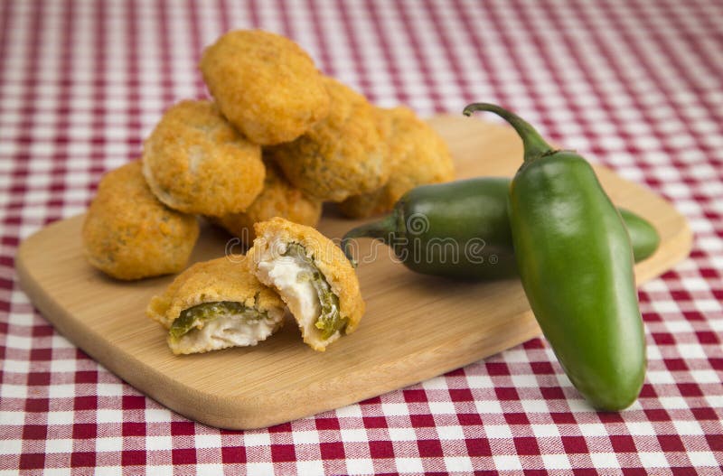 Plate of Jalapeno Poppers on a Red Gingham Tablecloth. Plate of Jalapeno Poppers on a Red Gingham Tablecloth