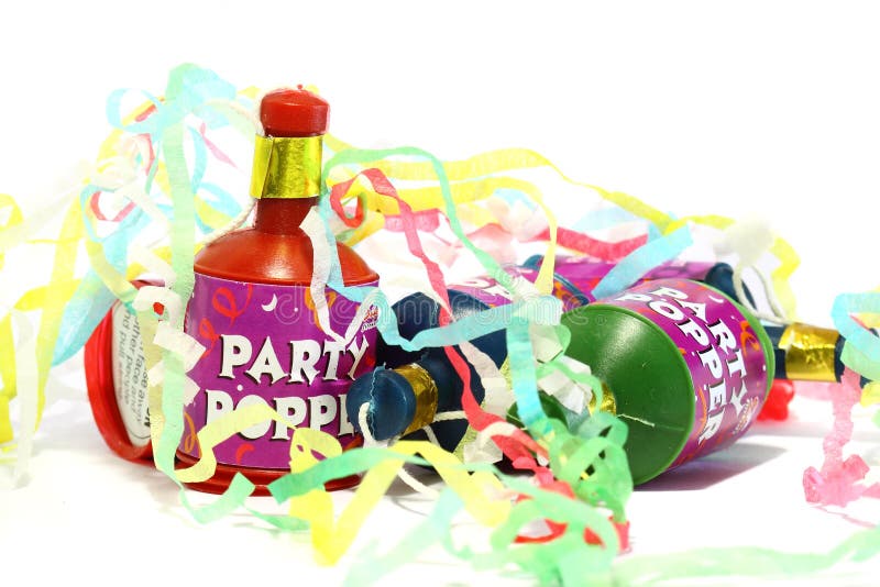 Photograph of party poppers and streamers isolated on a white background. Photograph of party poppers and streamers isolated on a white background.