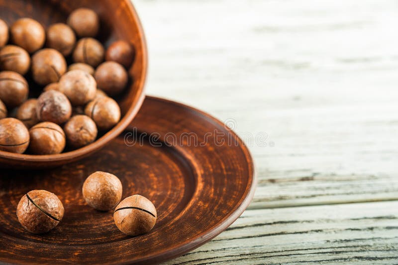 Macedonian Nuts on a Wooden Plate on the Background of a Textural