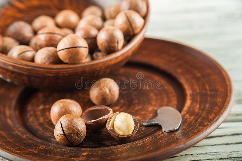 Macedonian Nuts on a Wooden Plate on the Background of a Textural