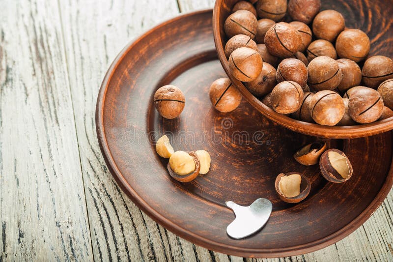 Macedonian Nuts on a Wooden Plate on the Background of a Textural
