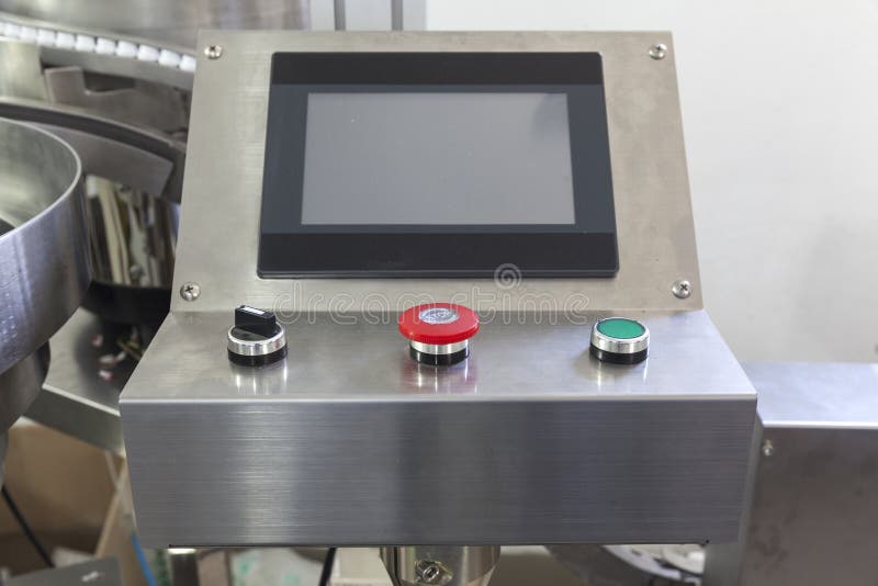 Machine for automatically placing plastic lids royalty free stock photo