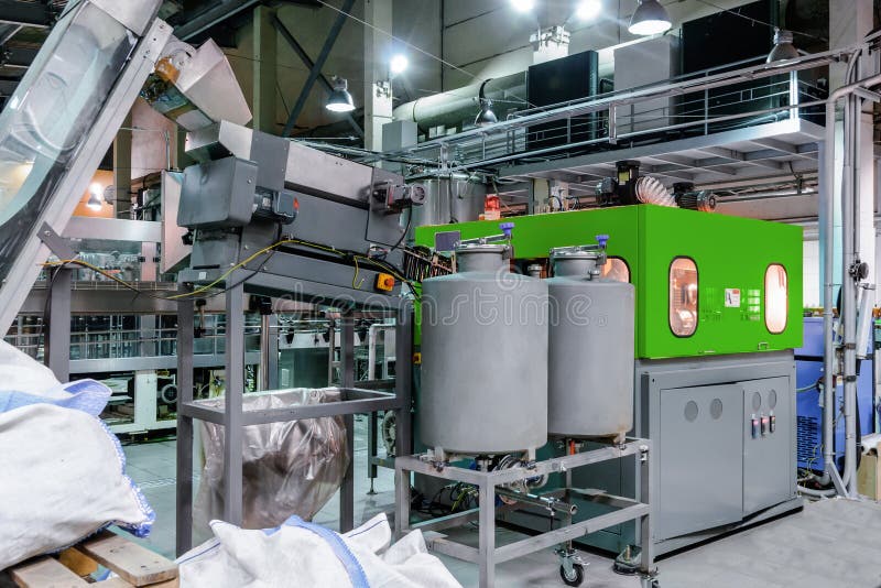 The Machine for Blowing Plastic PET Bottles. Stock Image Image of
