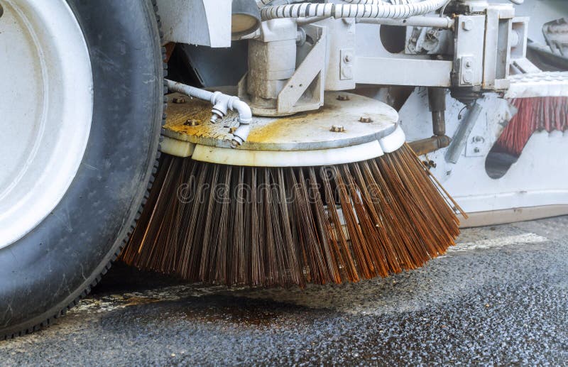 Machine car cleaning the road detail of a street sweeper