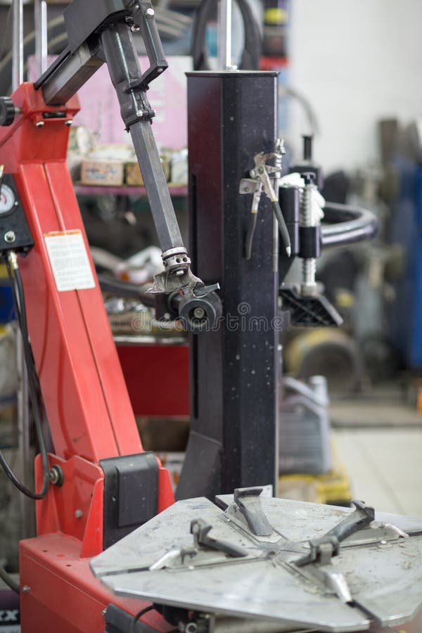 Machine for Changing Car Tire Fitting. Wheel Tyre Repairing. Stock