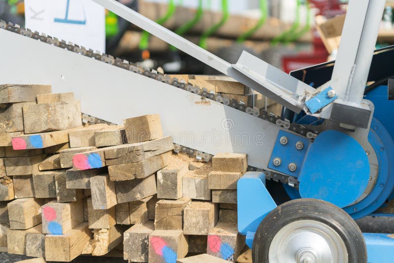 Machine for cutting firewood. chopping firewood with a machine close up stock photo