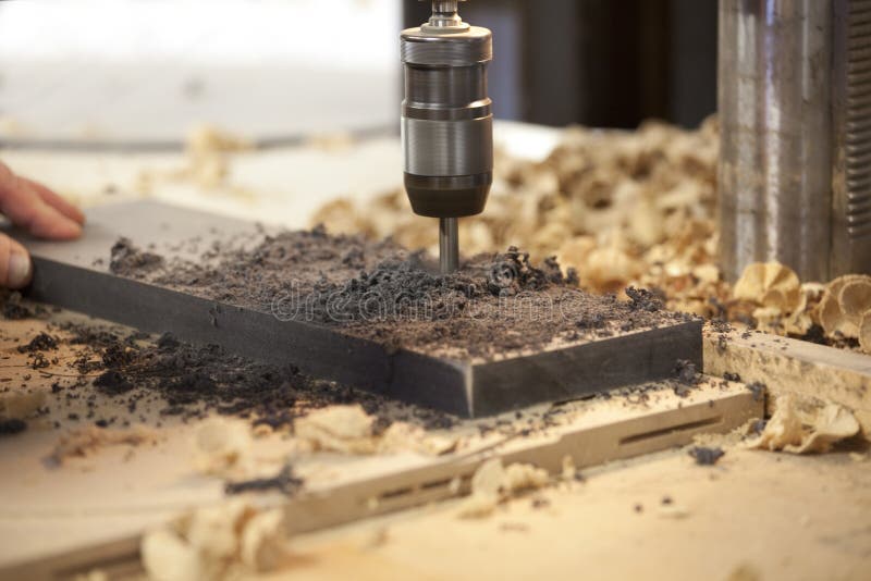 Machine drilling a hole stock image Machine drilling a hole stock image