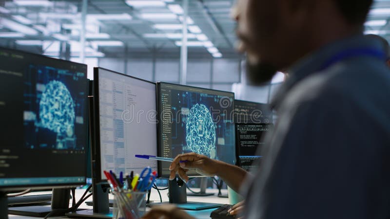 Machine learning expert in data center maintaining company network stock photography