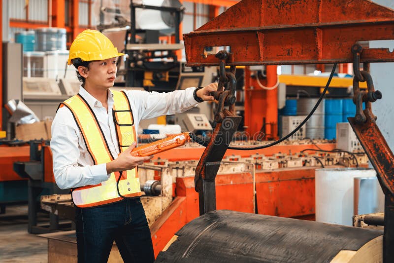 Machine operator skillfully operate steel forming machinery. Exemplifying royalty free stock photography
