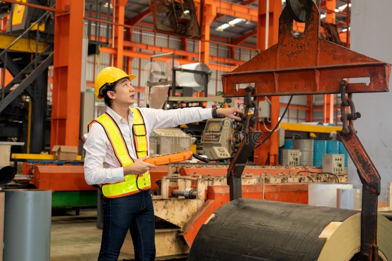 Machine operator skillfully operate steel forming machinery. Exemplifying royalty free stock photography