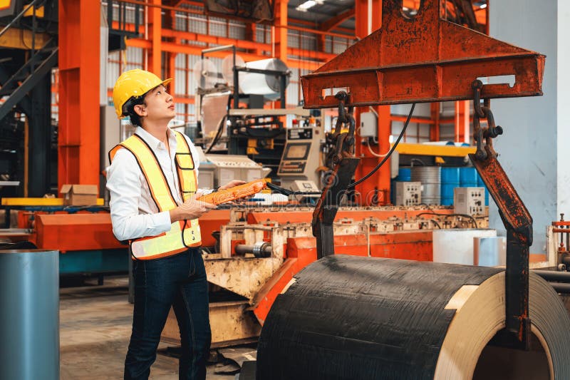 Machine operator skillfully operate steel forming machinery. Exemplifying royalty free stock photo