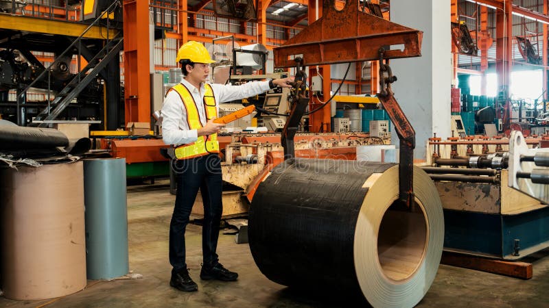 Machine operator skillfully operate steel forming machinery. Exemplifying royalty free stock photos