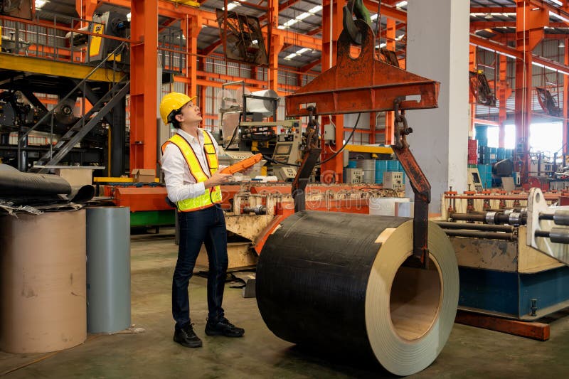 Machine operator skillfully operate steel forming machinery. Exemplifying royalty free stock photography