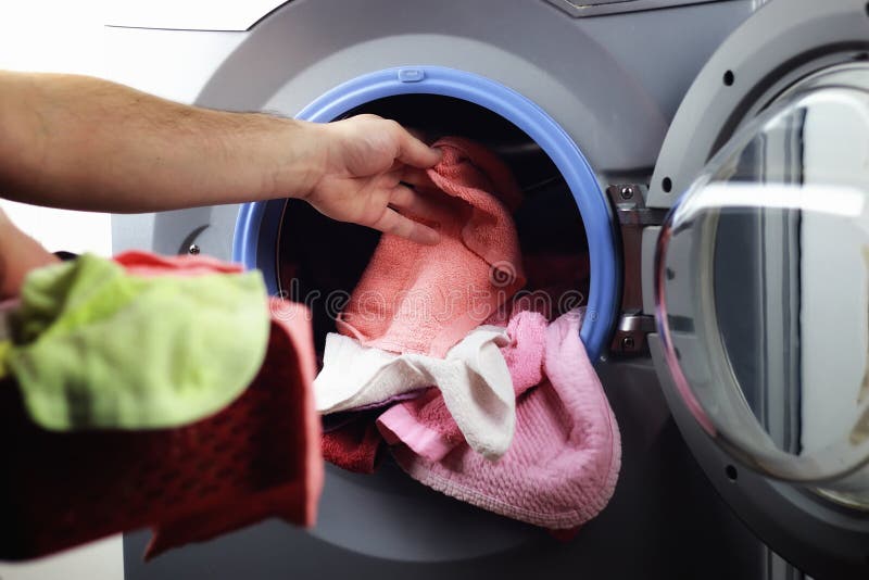 Machine Washer hand put stock image. Image of housework 79694001