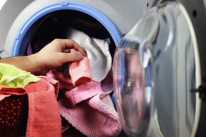 Machine Washer hand put stock photo. Image of chores 90209710