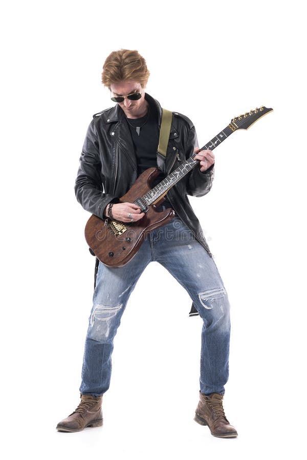 Macho young stylish man rock musician playing electric guitar solo looking down.