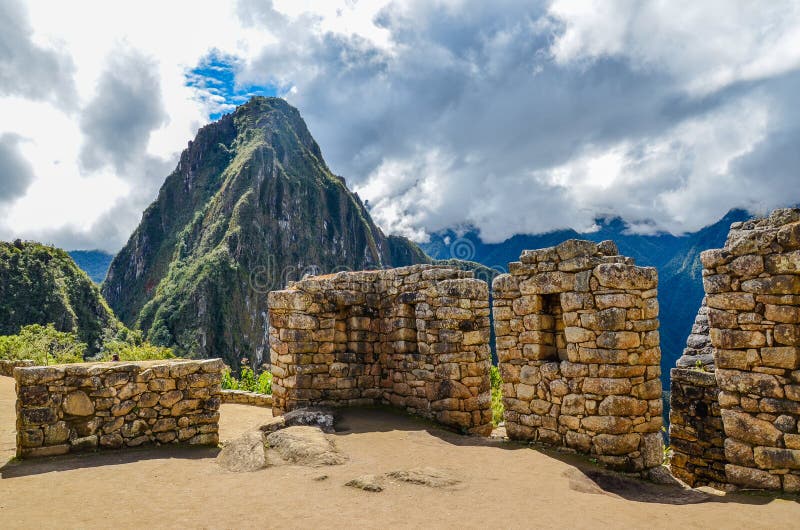 MACHU PICCHU, CUSCO REGION, PERU- JUNE 4, 2013: Panoramic view of the 15th-century Inca citadel Machu Picchu royalty free stock photos MACHU PICCHU, CUSCO REGION, PERU- JUNE 4, 2013: Panoramic view of the 15th-century Inca citadel Machu Picchu royalty free stock photos