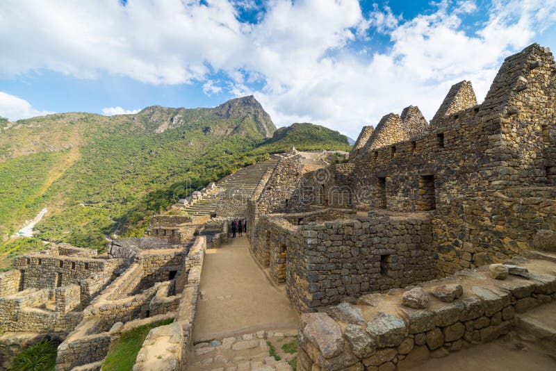 Machu Picchu illuminated by the last sunlight. Wide angle view from below over the glowing terraces with scenic sky. Machu Picchu royalty free stock images Machu Picchu illuminated by the last sunlight. Wide angle view from below over the glowing terraces with scenic sky. Machu Picchu royalty free stock images