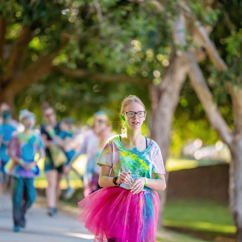 Young Girl Walks In Color Frenzy Fun Run stock photos Young Girl Walks In Color Frenzy Fun Run stock photos