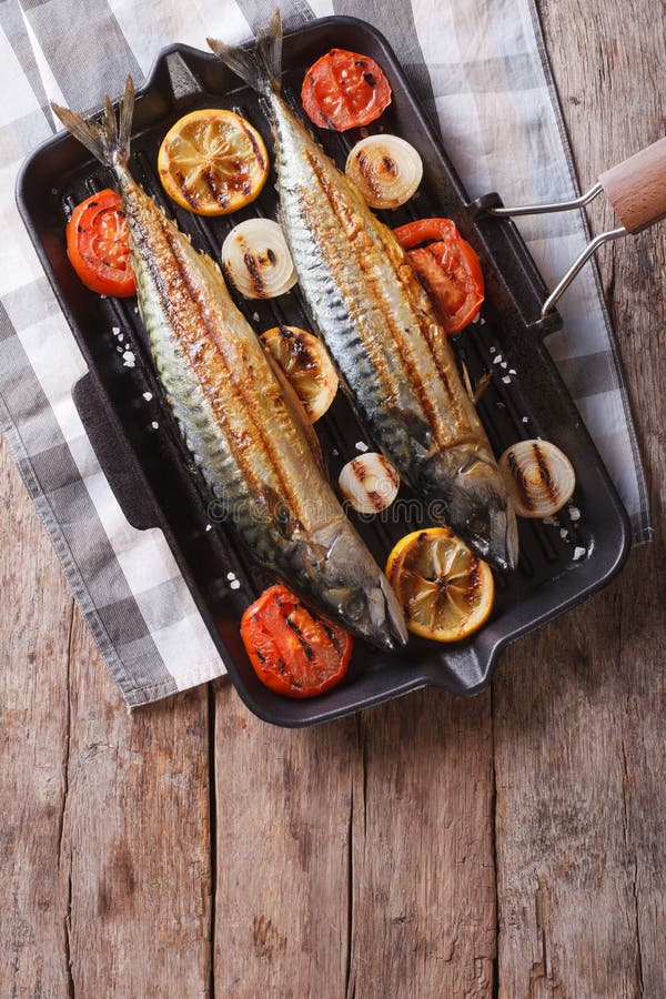 Mackerel Fish and Vegetables in a Pan Grill. Vertical Top View Stock