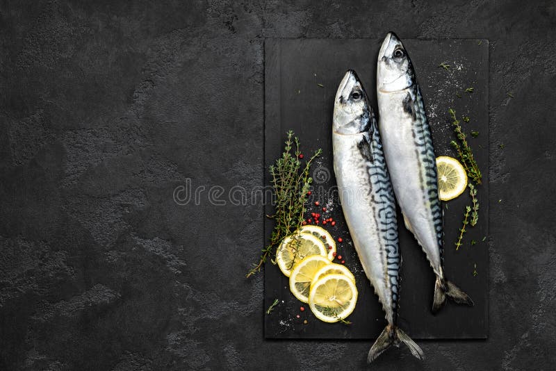 Mackerel. Fresh raw fish with ingredients for cooking, top view stock image Mackerel. Fresh raw fish with ingredients for cooking, top view stock image