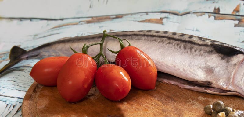 Mackerel, tomatoes and capers stock images Mackerel, tomatoes and capers stock images