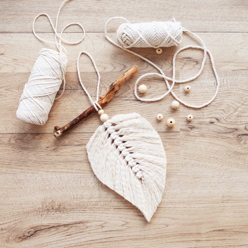 https://thumbs.dreamstime.com/b/macrame-leaf-natural-color-thread-windings-lying-wooden-table-cotton-rope-decor-to-make-your-room-more-cozy-unique-239979669.jpg