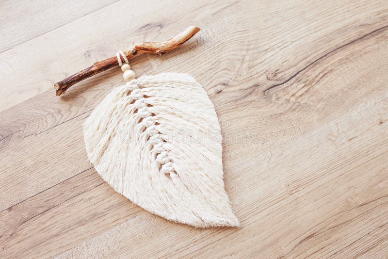 https://thumbs.dreamstime.com/b/macrame-leaf-natural-color-wooden-table-cotton-rope-decor-macrame-to-make-your-room-more-cozy-unique-woman-hobby-234389365.jpg