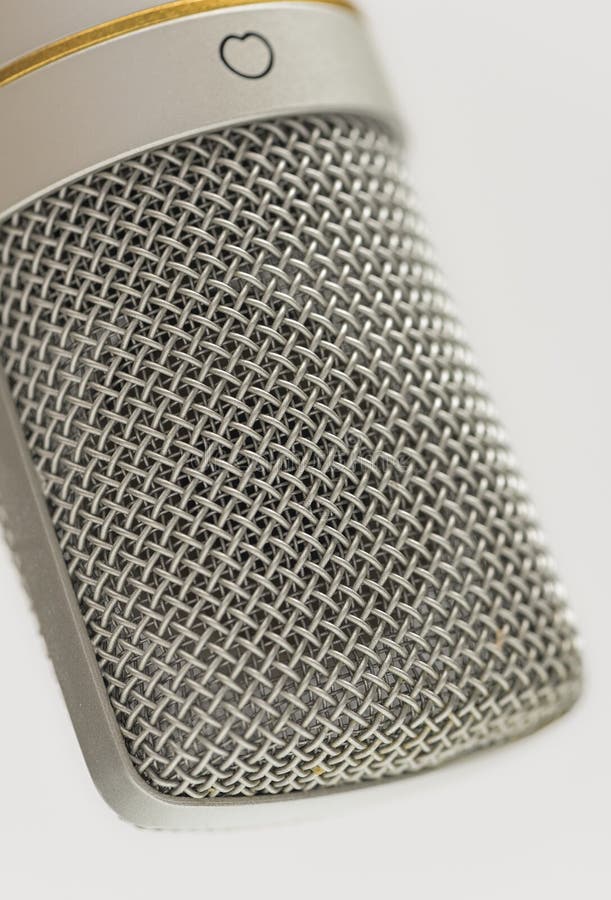 Close-Up of Studio Microphone Metal Mesh Grille Showing Fine Detail and Texture for Audio Recording and Podcast Themes royalty free stock photos