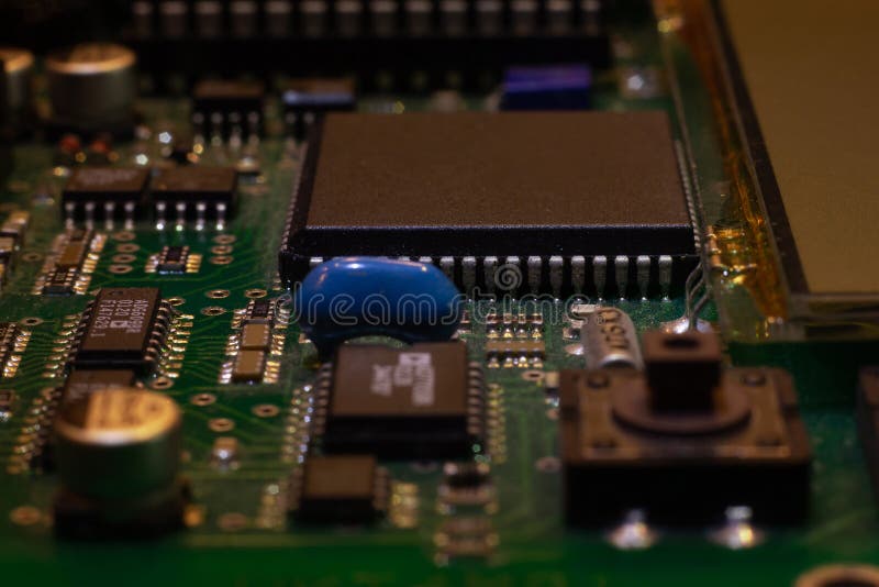 Macro close-up shot of green circuit board, computer motherboard Components: microcircuits, processor, transistors, semiconductors royalty free stock image