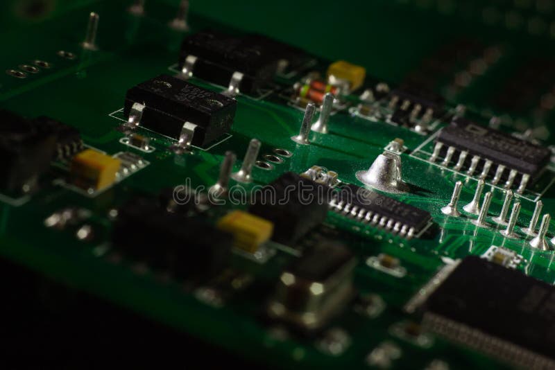 Macro close-up shot of green circuit board, computer motherboard Components: microcircuits, processor, transistors, semiconductors royalty free stock photography