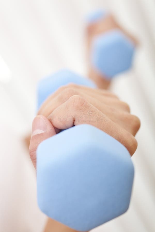 Macro Close Up Of Woman Lifting Weights at Gym royalty free stock photo
