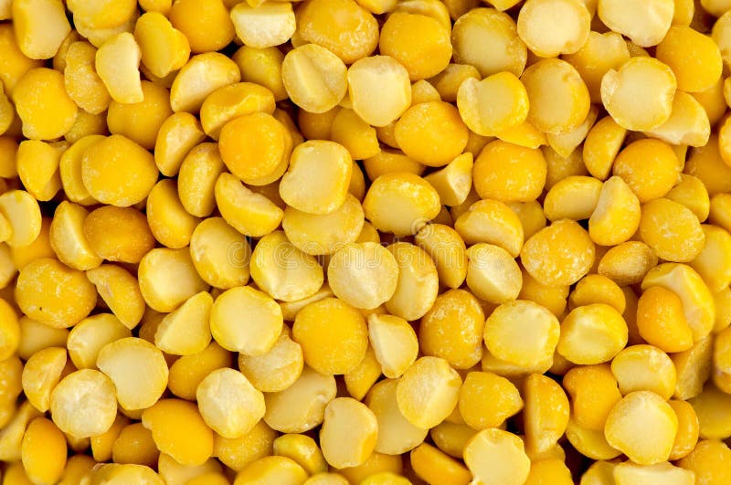 Macro closeup background texture of yellow split peas