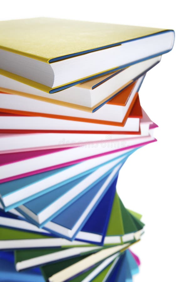 Macro of spiral stack of colorful real books on white background, top view. Macro of spiral stack of colorful real books on white background, top view.