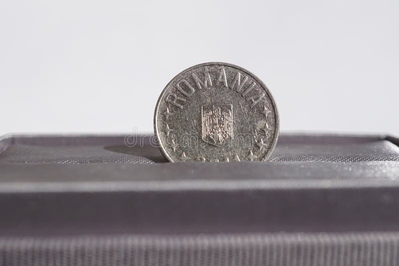 Macro detail of a metal coin of ten Bani (Romanian currency RON also called Lei or Leu