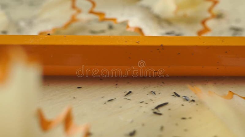Macro dolly shot of sharpener and sharp pencil with eraser stock video