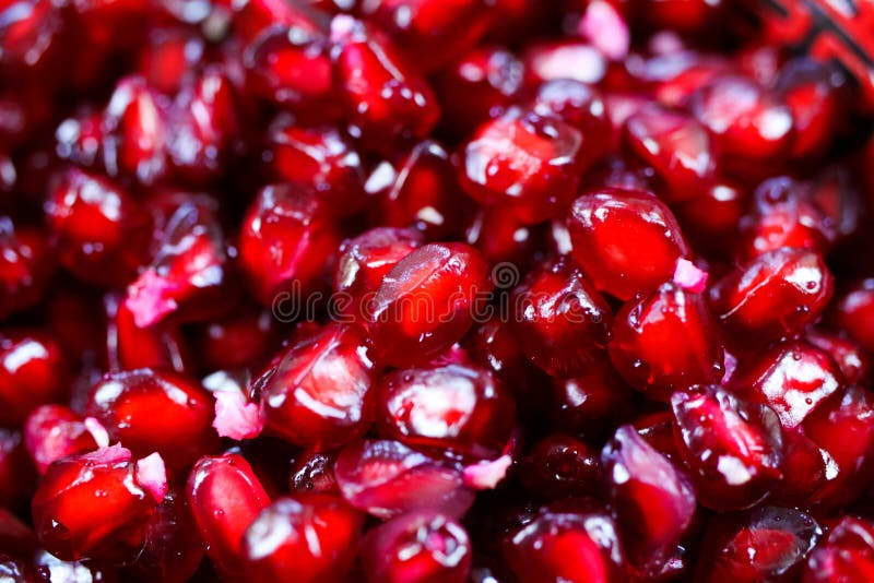 Macro full frame close up of red shiny juicy pomegranate seeds focus on center royalty free stock photos Macro full frame close up of red shiny juicy pomegranate seeds focus on center royalty free stock photos