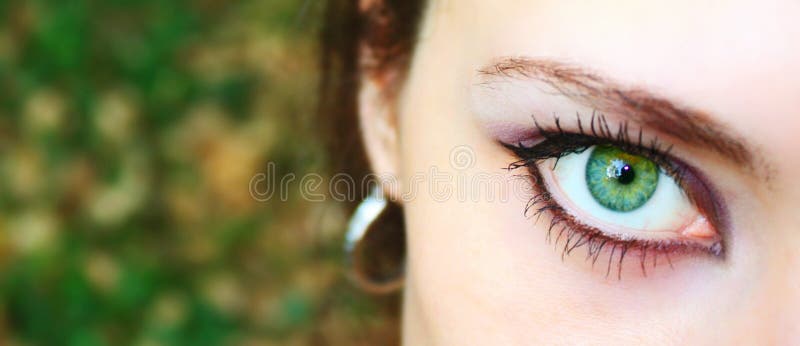 Macro green eye of beautiful girl