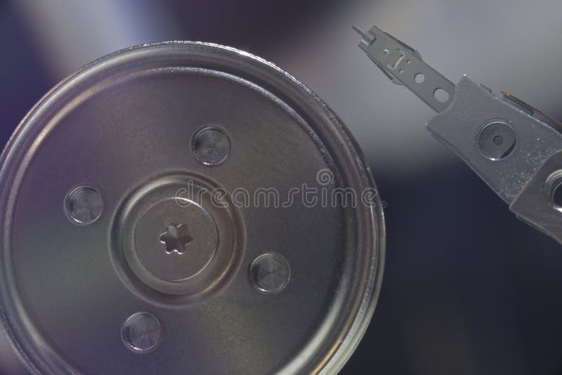 Macro Image of Hard Disk Spindle Hub and Read Write Head in Precision Alignment During Idle State royalty free stock photography