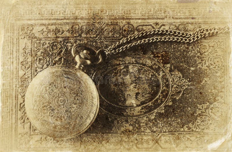 Macro image of old vintage pocket watch on antique book. top view. retro filtered image, old style photo. Macro image of old vintage pocket watch on antique book. top view. retro filtered image, old style photo.