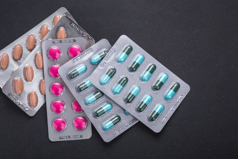 Macro medicine blister pack on black background. For hospital, d stock photos Macro medicine blister pack on black background. For hospital, d stock photos