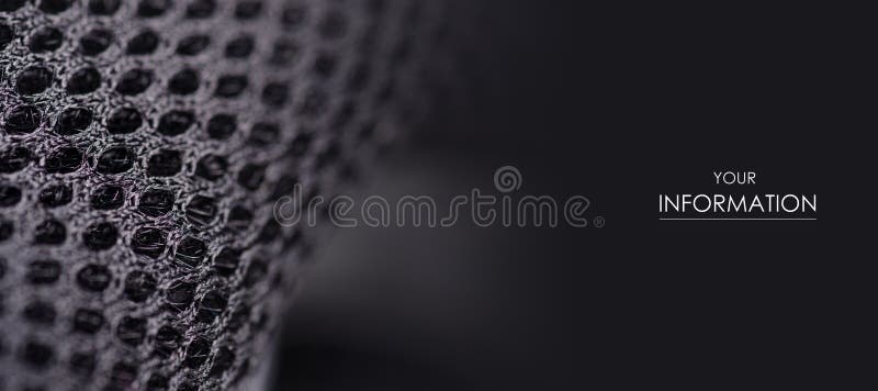 Macro modello del tessuto del metallo materiale nero degli accessori sul fondo della sfuocatura