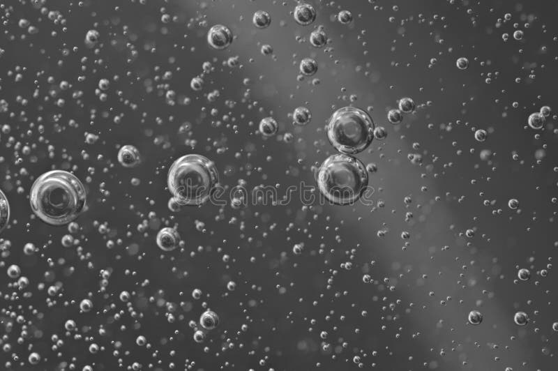 Macro Oxygen bubbles in water on black-and-white background royalty free stock image Macro Oxygen bubbles in water on black-and-white background royalty free stock image