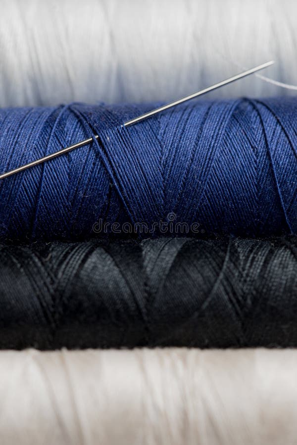 Spool of Black Nylon Thread. a Small Part of the Thread from the