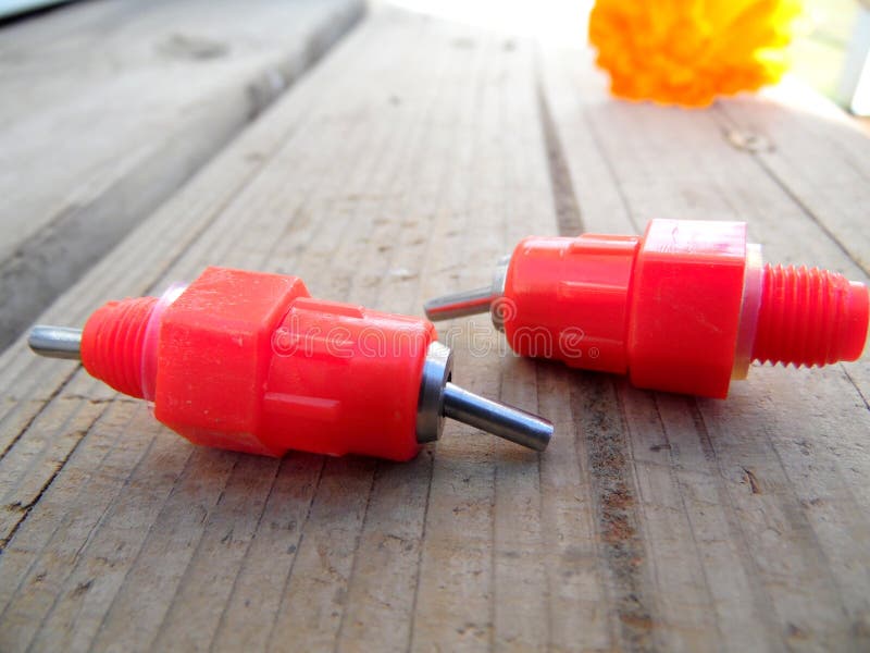 Macro Photograph of Threaded Poultry Water Nipples