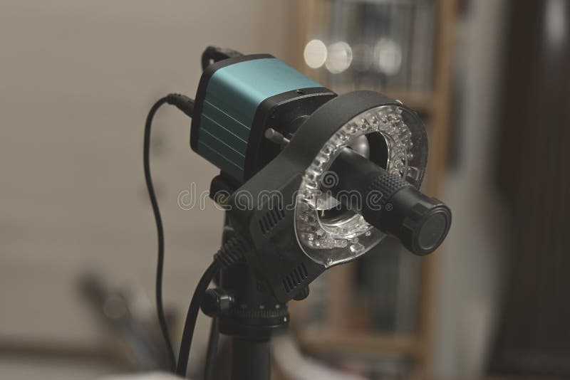 Macro photography ring light attached to a studio focusing rail system in a professional setup royalty free stock images